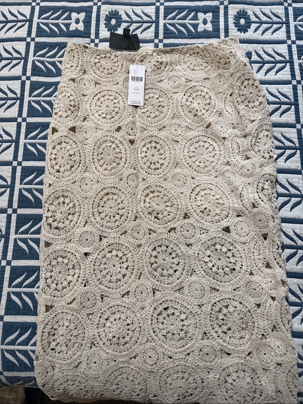 Beige Crochet Midi Skirt by Anthropologie.
